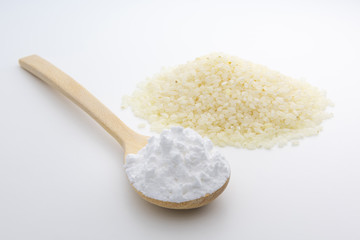 Fototapeta na wymiar Wooden spoon with Japanese rice starch flour, closeup, Short Grain Sushi Koshihikari Rice, High resolution.