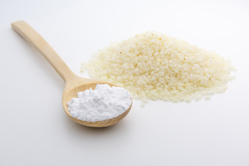 Wooden spoon with Japanese rice starch flour, closeup, Short Grain Sushi Koshihikari Rice, High resolution.