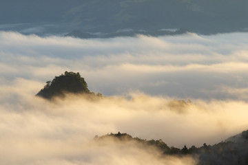 Silhouette of Mountain With Fluffy Clouds during Sunrise