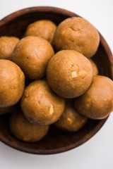Churma Ladoo / atta laddoo / wheat flour laddu made using ghee and jaggery or sugar. selective focus