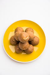 Churma Ladoo / atta laddoo / wheat flour laddu made using ghee and jaggery or sugar. selective focus