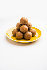Churma Ladoo / atta laddoo / wheat flour laddu made using ghee and jaggery or sugar. selective focus