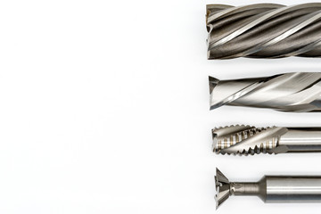 Professional cutting tools used for metalwork. Multi-flute drill, broach bit, Stainless Drill bit, Tap for thread - obrazy, fototapety, plakaty