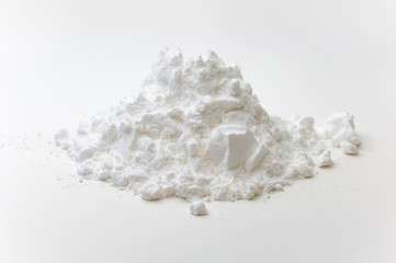 Fototapeta na wymiar Close-up of tapioca starch or flour powder in wooden spoon on white background