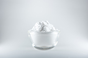 Close-up of flour or starch, Corn starch or tapioca starch powder in glass bowl background isolate
