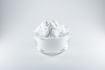 Close-up of flour or starch, Corn starch or tapioca starch powder in glass bowl background isolate