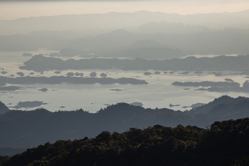 Silhouette of Mountain With Fluffy Clouds during Sunrise