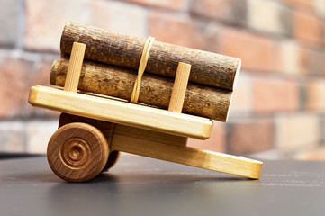 decorative brown wooden trailer with  bunch of logs located in the home interior