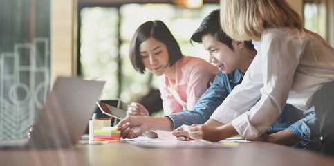 Close-up of UX web development plaining the idea on smartphone application together