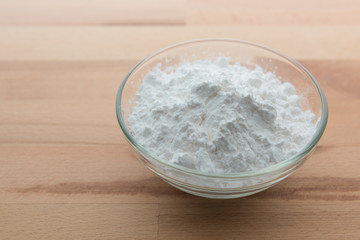 Close-up of flour or starch, Corn starch or tapioca starch powder in glass bowl background isolate