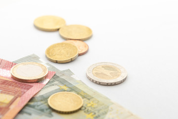 Close-up euro banknotes and coin background isolate