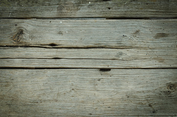 Fototapeta premium Old wooden surfaces eroded by rain and sunlight according to the time, the beauty of the background caused by the creative nature