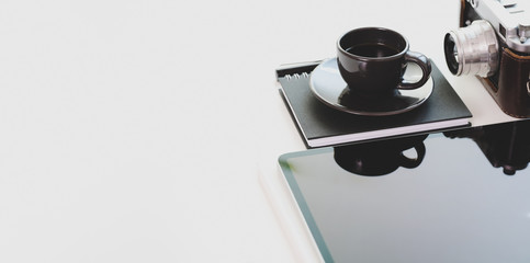 Cropped shot of photographer workplace with copy space, camera and office supplies