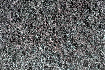 Dark abstract background and pattern of interwoven hairs, fibers and nanofibers. Sponge detail texture, sponge texture closeup background. Cellulose sponge texture. Black and white