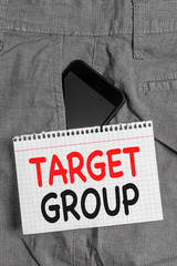 Handwriting text Target Group. Conceptual photo Particular showing that an advertisement intended to reach to Smartphone device inside formal work trousers front pocket near note paper