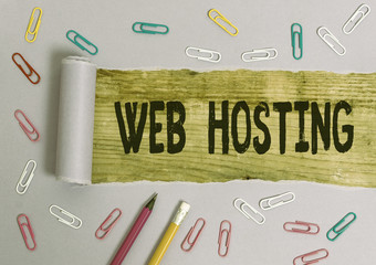 Writing note showing Web Hosting. Business concept for The activity of providing storage space and...