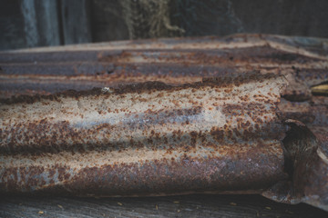 The tin roof background with the rust and nails hole by vintage style.