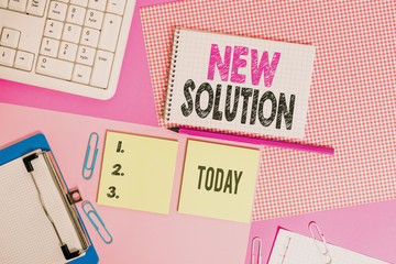 Text sign showing New Solution. Business photo text Modern Innovation Latest effective approach to a problem Writing equipments and computer stuffs placed above colored plain table