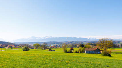 Bavarian landscape with mountains in background at lake Waginger See