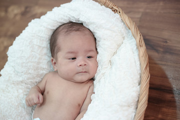 Baby lying on the bed