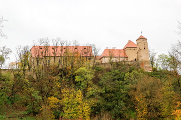 Fototapeta premium Medieval Veveri castle near Brno, Czech republic in autumn forest