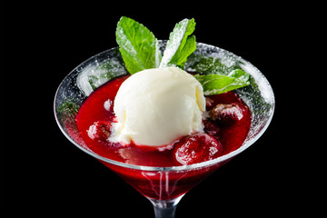ice cream dessert and cherry in a glass