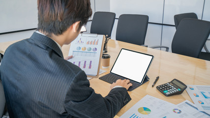 Obraz na płótnie Canvas businessman working and checklist on financial chart report. 