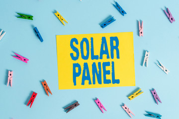 Handwriting text Solar Panel. Conceptual photo designed to absorb suns rays source of energy generating Colored clothespin rectangle shaped reminder paper light blue background