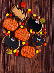Halloween cookies over dark wooden background