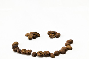 Roasted Coffee Beans background texture in the shape of a smile, isolated on white background with space for text