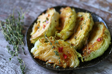 Sliced cabbage baked with herbs and spices. Vegan diet. Healthy snack. Keto friendly.