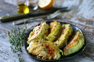 Sliced cabbage baked with herbs and spices. Vegan diet. Healthy snack. Keto friendly.