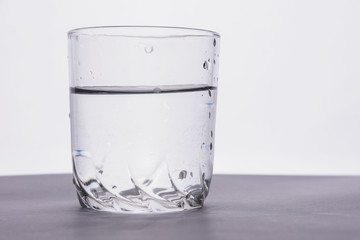 glass of fresh water on a white background
