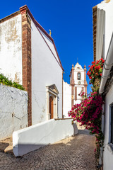 A picturesque street in Silves old town leading to the Cathedral, Algarve, Portugal,