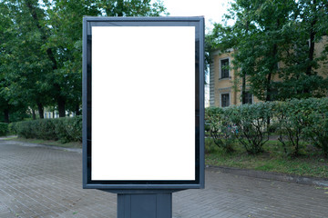 vertical billboard standing in the city on a rainy cold day