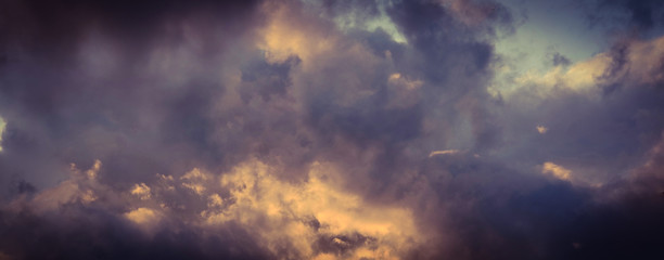 Fototapeta na wymiar Vintage background of dramatically illuminated stormy clouds