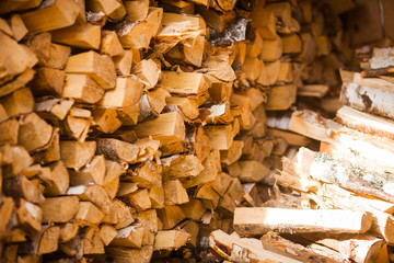 Firewood in the barn. Firewood for the winter. Logging and stockpiling firewood in the village