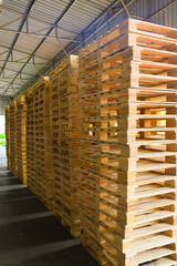 Wooden pallets stack at the freight cargo warehouse for transportation and logistics industrial