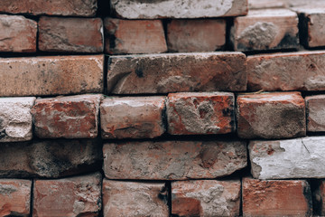 Old brick wall. Photo background with old brick wall close-up. Vintage bricks texture with copy space
