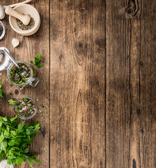 Chimichurri on an old wooden table (selective focus)