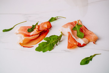 Slice of smoked ham on a white background