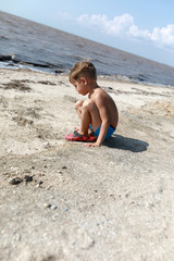 Child on beach of Sea of Azov