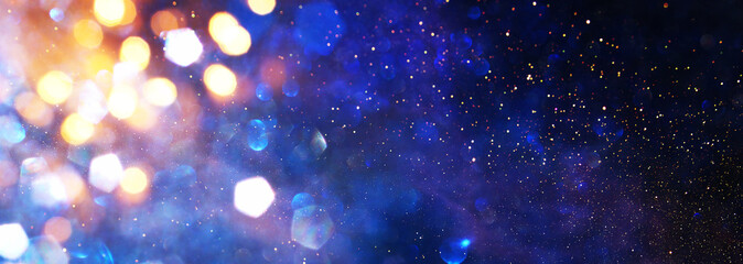 abstract glitter silver, gold , blue lights background. de-focused. banner