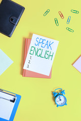 Handwriting text Speak English. Conceptual photo Study another Foreign Language Online Verbal Courses Paper clips with blank papers for text messages