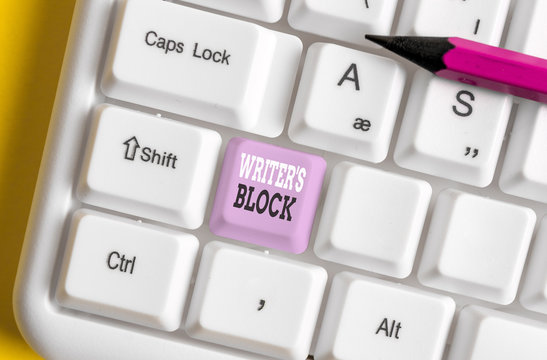 Writing note showing Writer S Block. Business concept for Condition of being unable to think of what to write White pc keyboard with note paper above the white background