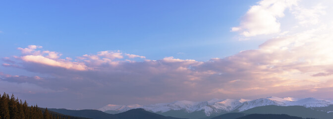 Fototapeta premium View of dramatic Carpathian mountains sky with colorful clouds and beautiful scenery