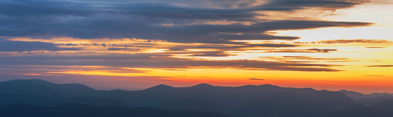 View of dramatic Carpathian mountains sky with colorful clouds and beautiful scenery
