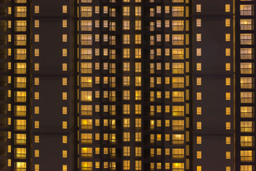 Fototapeta na wymiar Bright yellow light beautiful real estate industry large residential building architectural model facade closeup