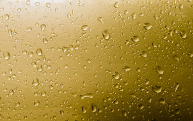 Gold drops abstract background, metallic color