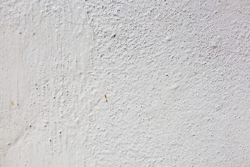 Texture of a concrete wall with cracks and scratches which can be used as a background